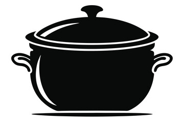 A black pot with a lid and handles is standing on a flat surface
