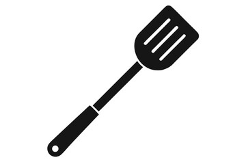 Solid black spatula with three slots and long handle rests diagonally on white