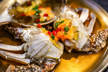 Traditional Korean Soy Sauce Marinated Crab (Ganjang Gejang) on Brass Plate. Close-up of Ganjang Gejang, a traditional Korean dish made from raw crab marinated in soy sauce.
