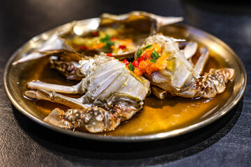 Close-Up of Ganjang Gejang – Korean Soy Sauce Marinated Raw Crab with Roe. Extreme close-up of traditional Korean Ganjang Gejang, featuring raw blue crab marinated in soy sauce.