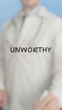 Professional medical expert crossing out negative unworthy word on transparent board, symbolizing personal empowerment and mental health transformation against blue background