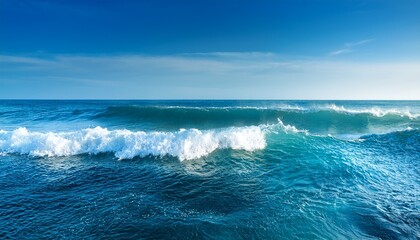 Fototapeta premium ocean waves on sunny day splashing waves blue clean wavy sea water