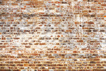 cracked fragment of an old red brick wall,