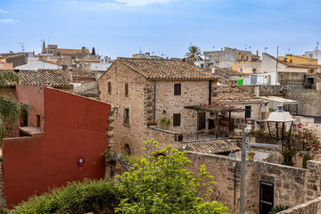 Alcudia is an ancient city on the island of Mallorca with a view of ancient walls, residential buildings
