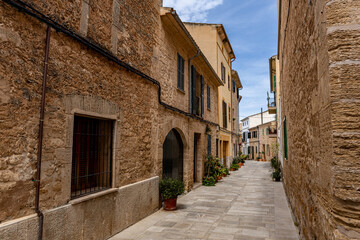 Alcudia is an ancient city on the island of Mallorca with a view of ancient walls, residential buildings