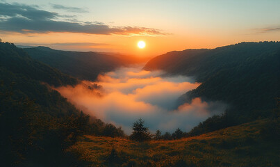 Naklejka premium Sunrise Over Foggy Mountain Valley