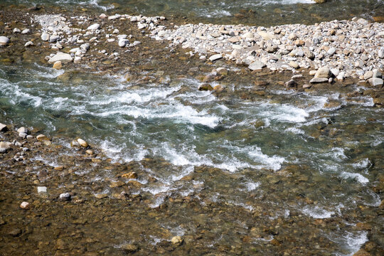 A river with a rocky shoreline