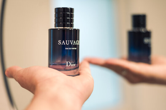 Sauvage Dior gentleman perfume in hand by the mirror in the bathroom, eau de toilette, fragrance,  sensual