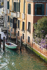 Old houses facades and channel in the old center of Venice, Italy