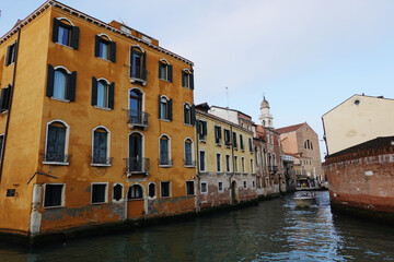 Old houses facades and channel in the old center of Venice, Italy