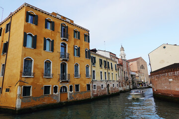 Old houses facades and channel in the old center of Venice, Italy