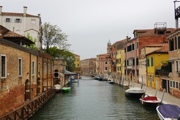 Old houses facades and channel in the old center of Venice, Italy
