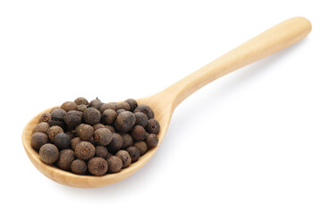 Aromatic allspice in wooden spoon isolated on white