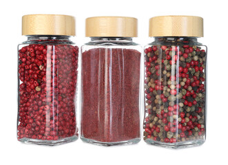 Many different aromatic spices in jars isolated on white