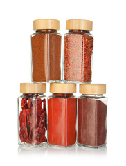 Many different aromatic spices in jars isolated on white
