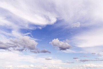 Beautiful soft gentle cloudy blue sky with white light cirrus clouds, abstract background texture