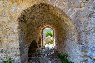 Fototapeta premium Vaulted passageway in Stari grad Bar (Old Town of Bar), the ruins of an ancient walled city at the foot of Mount Rumija in Montenegro