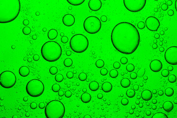 Green macro drink bubble texture,Macro bubble texture green,Close up macro Aloe vera gel serum cosmetic texture green background with bubbles. Cruelty free. Lemongrass gel skincare product. 