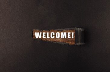 Piece of paper with the word welcome written on it