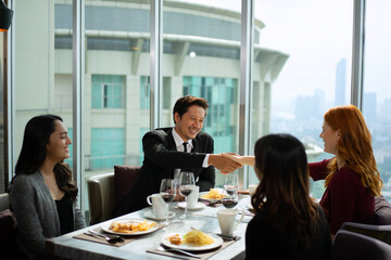 Group of diversity people are celebrating at luxury restaurant.