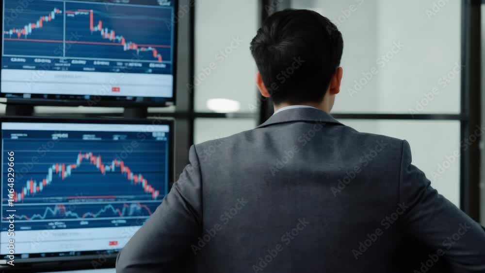 Poster an analyst turns toward monitors displaying red falling lines while adjusting his blazer. concept of