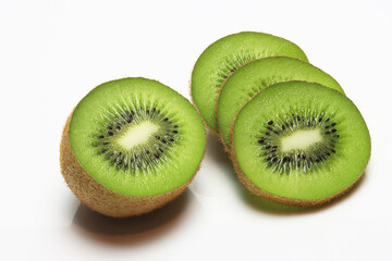 Fototapeta premium Fresh Kiwi fruit , sliced , halved on white background