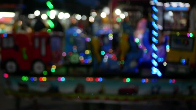 Blurry footage of circle blur or bokeh light with many colour in the night market city in indonesia or pasar malam