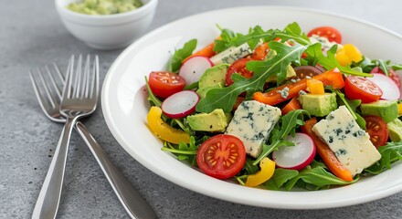 Salad with Blue Cheese, Avocado, Tomato, and Arugula