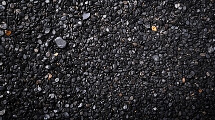 Dark grey pebble stones background texture image pattern design sea rock wall rough small black floor