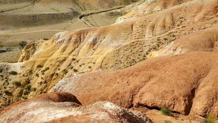Scenic view of colorful layered rock formations and rolling hills, natural landscape, vibrant earth...