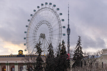Ostankino TV Tower and Ferris wheel at the exhibition of achievements of the national economy in...