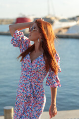 Beautiful young girl by the sea