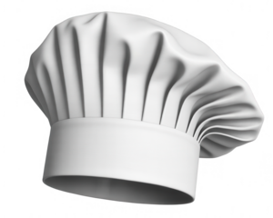 A white chef hat with pleats and a cylindrical base isolated on a black background in a studio shot
