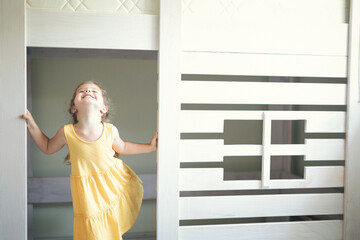 Young man with his daughter assembling furniture at home