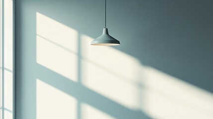 Modern minimalist pendant light fixture interior scene with sunlight shadows