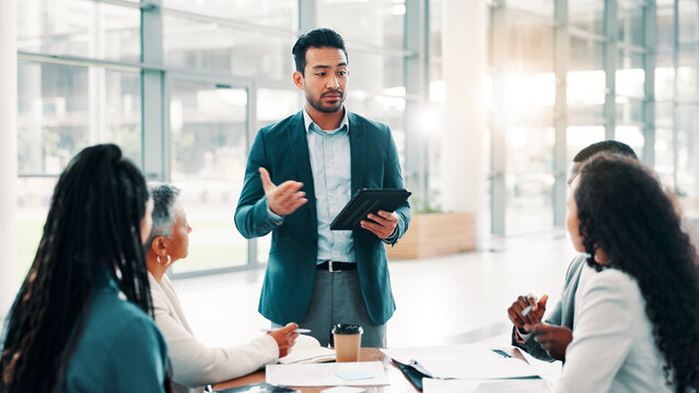 Businessman, discussion and tablet in office for meeting, campaign management and project feedback. Company team, leader and workshop with tech for brainstorming, presentation planning and advice