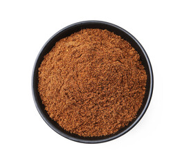 Superfood. Nutmeg powder in bowl isolated on white, top view