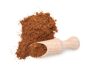 Superfood. Nutmeg powder and scoop isolated on white, top view