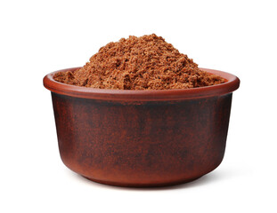 Superfood. Nutmeg powder in bowl isolated on white