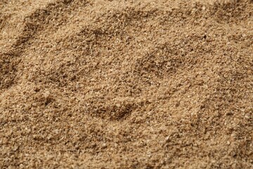 Superfood. Coriander powder as background, closeup view