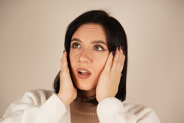 It is a gesture of relaxation and release of tension. With her hands resting on her head and her...