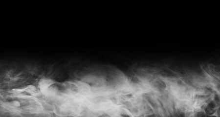 Abstract smoke texture over black background. Fog in the darkness.