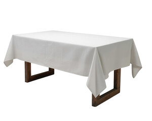A rectangular wooden table draped with a crisp white tablecloth against a black background plain setting