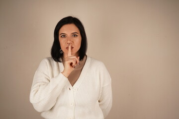A subtle and timeless gesture, understood by all. One finger placed on the lips signals a gesture...