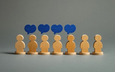 Wooden figures, representing people, with blue speech bubbles above a select few, suggesting communication and highlighting a specific group