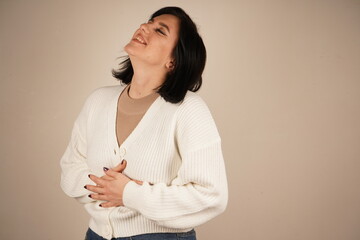 The joyful expression on her face conveys pure happiness and warmth. This gesture emphasizes her...