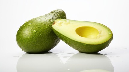 Fresh and Ripe Avocado Cut in Half on Reflective Surface with Water Droplets Showcasing Creamy Texture and Vibrant Green Color for Healthy Lifestyle and Culinary Use