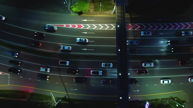 Drone shot of busy multilane road with cars at night