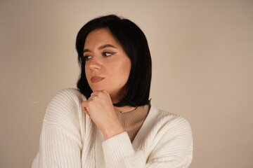 With hands layered, the woman emanates a sense of purpose and self-assurance. Her determined gaze...