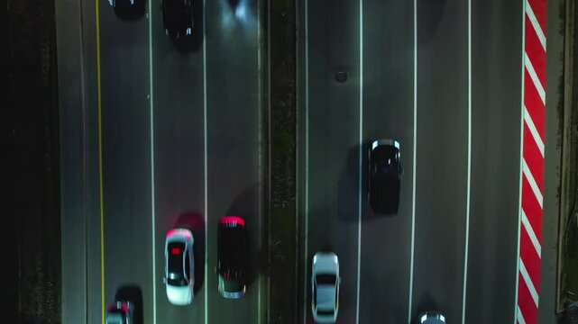 Drone shot of busy multilane road with cars at night